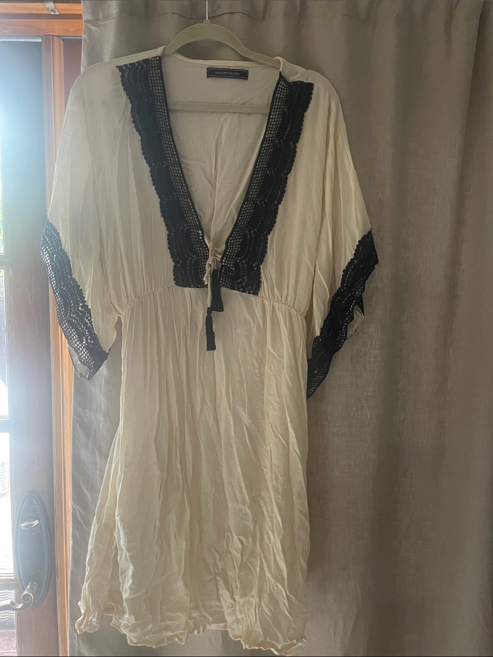 BCBG coverup Navy lace and tan with tie front tassels. Elastic waist wide sleeve